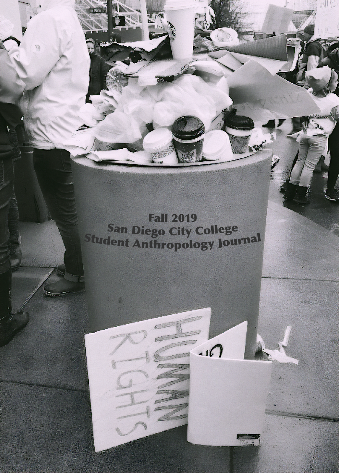 Journal cover, photo of an overflowing trash can with a sign resting on it that reads HUMAN RIGHTS and supperimposed on the trash can is Fall 2019 San Diego City College Student Anthropology Journal